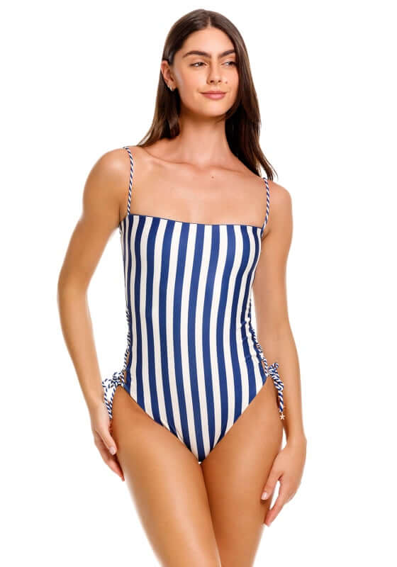 Mariel Sereia Swimsuit by Agua Bendita, showcasing a stylish striped design with lace-up side details.