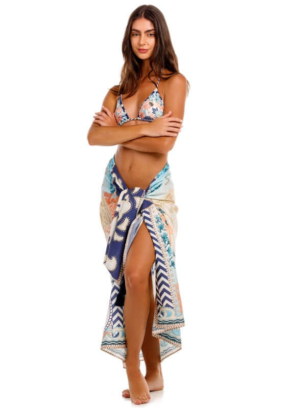 Marine Sereia Sarong by Agua Bendita worn as a skirt, showcasing stunning print and handmade tassels.