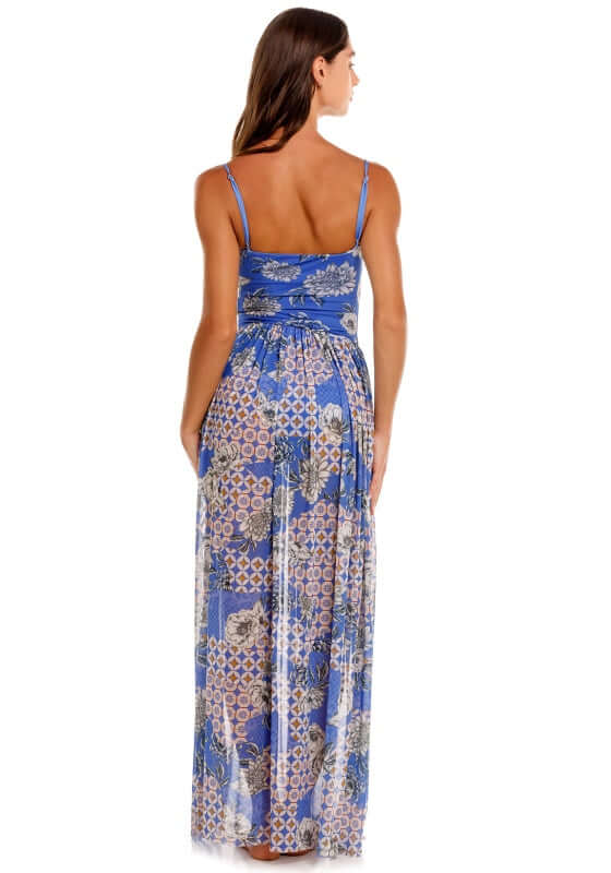 Meeg Quilt Maxi Dress by Agua Bendita, model showing back view with floral print and sheer skirt.