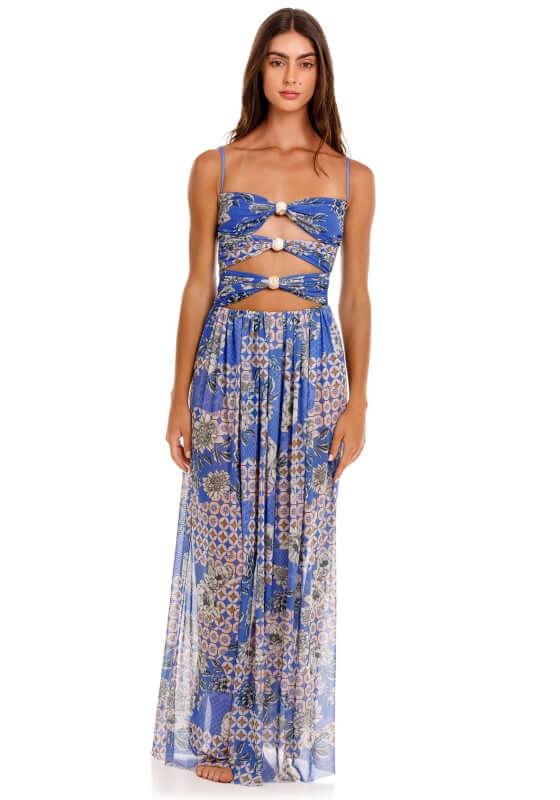 Meeg Quilt Maxi Dress by Agua Bendita showcasing bold front cutouts and sheer skirt on model standing.