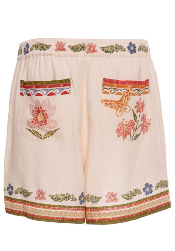 Watts Fiore Beach Shorts by Agua Bendita, featuring floral prints and an elastic waistband with practical pockets.