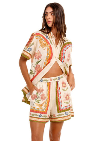 Watts Fiore Beach Shorts by Agua Bendita, showcasing vibrant print and relaxed fit, perfect for beachwear.