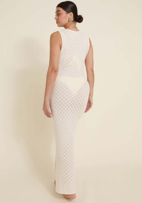 Dominica Dress Ivory by Away That Day, showcasing intricate crochet detailing and a form-fitting design from the back.