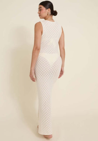 Dominica Dress Ivory by Away That Day, showcasing intricate crochet detailing and a form-fitting design from the back.