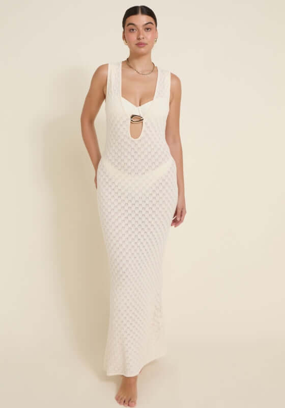 Dominica Dress Ivory by Away That Day model wearing a stunning crochet maxi dress with a front keyhole cutout.