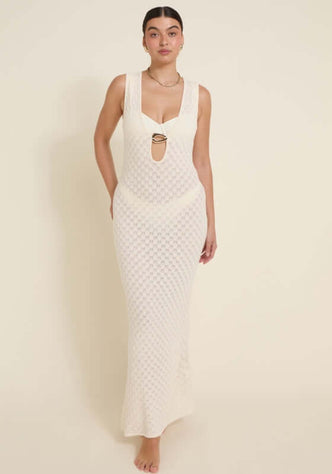 Dominica Dress Ivory by Away That Day model wearing a stunning crochet maxi dress with a front keyhole cutout.