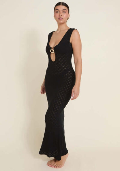 Dominica Dress Black by Away That Day, showcasing a crochet maxi with a front keyhole cutout and gold accents.