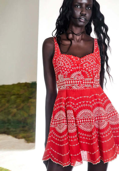 Winnie Dress Red Nelum by Charo Ruiz, shown in a model, featuring embroidered linen cotton blend in a skater silhouette.