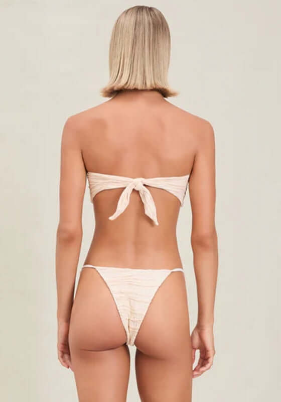 Alina Bikini Bottom Pebble by Devon Windsor, featuring a stylish back view of a peach bikini.