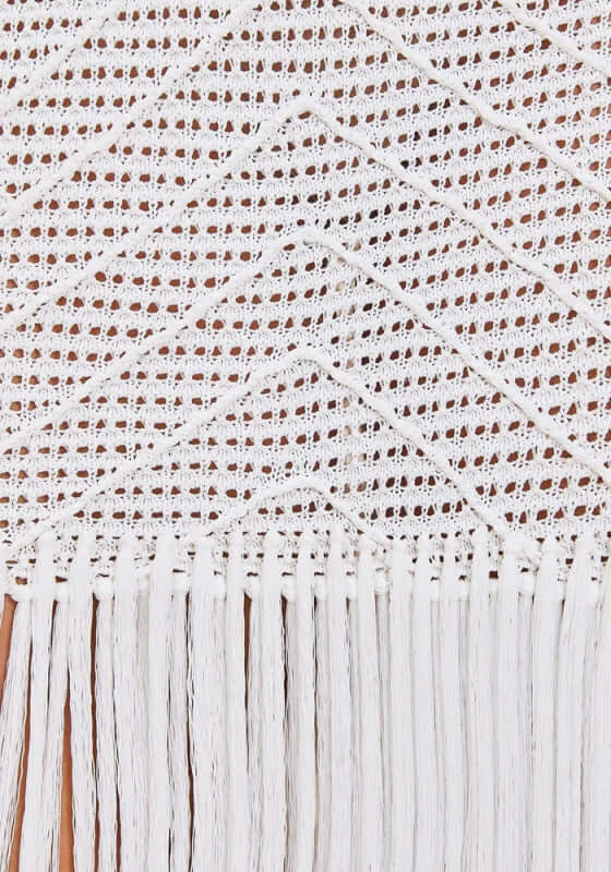 Edna Skirt Dove by Devon Windsor with intricate white knit fabric and long tassel hem, showcasing coastal elegance.