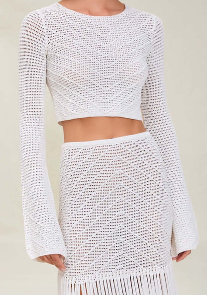 Erin Top Dove by Devon Windsor, a white knit cropped top with flared sleeves, showcasing coastal style and elegance.