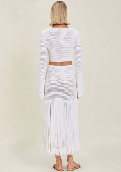 Erin Top Dove by Devon Windsor, a white knit beach top with flared sleeves and a cropped silhouette, perfect for coastal style.