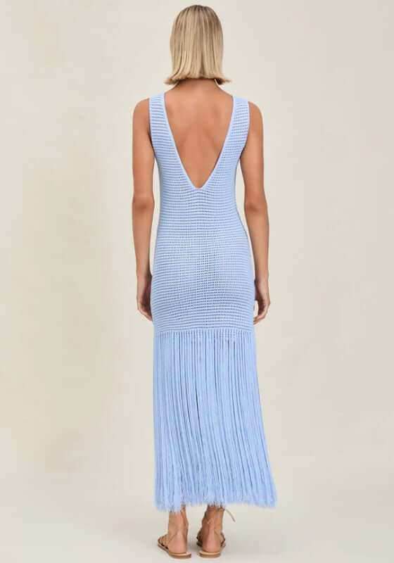 Leiza Dress Skylar by Devon Windsor features a light blue knit with a V-back and flowing fringe skirt.