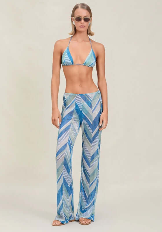 Ollie Beach Trousers Glacier by Devon Windsor, model showcases wide-leg trousers with chevron print in blue shades.