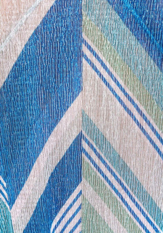 Winona Bikini Glacier by Devon Windsor features a blue asymmetric print with striking chevron detailing and thin straps.