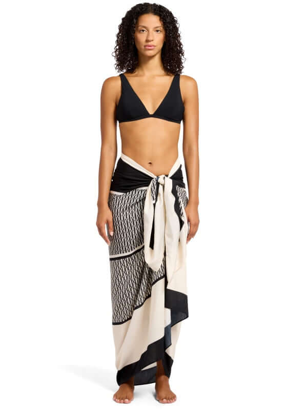 Black Spring Geo Long Sarong by Jets, featuring a model wearing a stylish black and ivory patterned sarong.