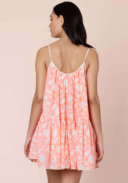 Pomegranate Strappy Mini Dress Neon Red by Juliet Dunn, back view of a lightweight, flared mini dress in vibrant neon red.