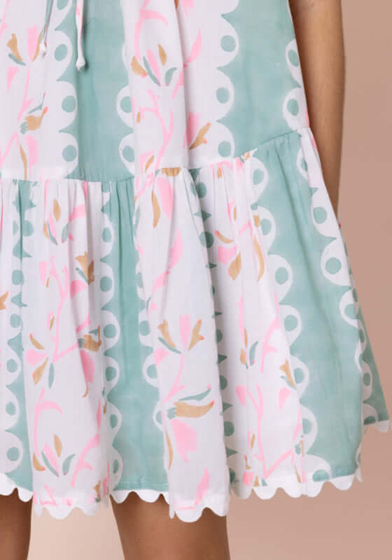 Bird Of Paradise Strappy Mini Dress Pistachio by Juliet Dunn, featuring a patterned hem and floral details.