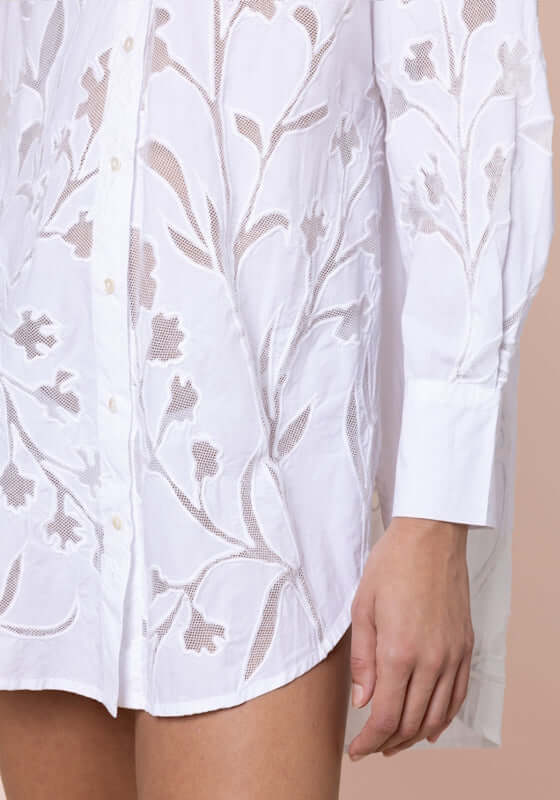 Floral Cutwork Shirt White by Juliet Dunn, showcasing intricate floral cutwork detailing on a white beach shirt.