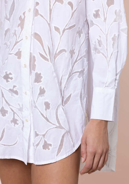 Floral Cutwork Shirt White by Juliet Dunn, showcasing intricate floral cutwork detailing on a white beach shirt.