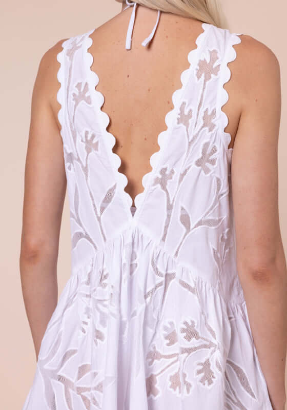 Floral Cutwork V Neck Mini Dress White by Juliet Dunn, showing intricate floral cutwork and scalloped back detail.