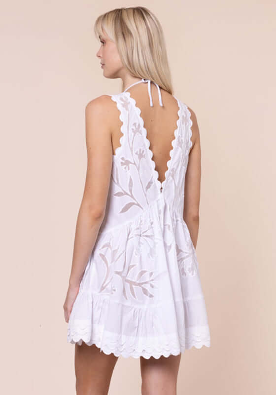 Floral Cutwork V Neck Mini Dress White by Juliet Dunn, showcasing delicate floral cutwork and a flattering V back.