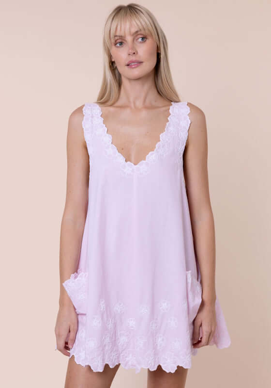 Poplin Floral Low Back Dress Petal Pink by Juliet Dunn model wearing a pink dress with lace accents.