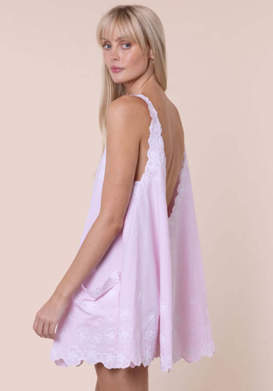 Poplin Floral Low Back Dress Petal Pink by Juliet Dunn, showcasing a model wearing the dress from the back, highlighting its elegant design.