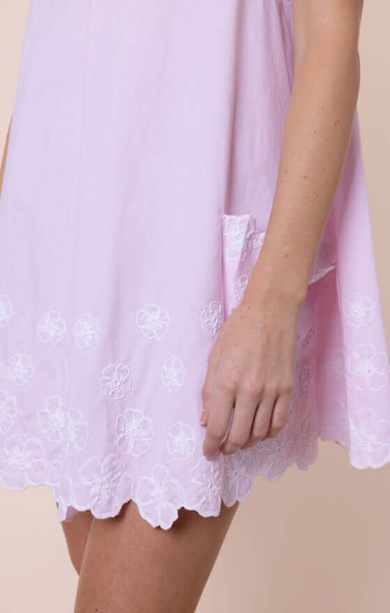 Poplin Floral Low Back Dress Petal Pink by Juliet Dunn, showcasing the elegant hem and floral embroidery details.