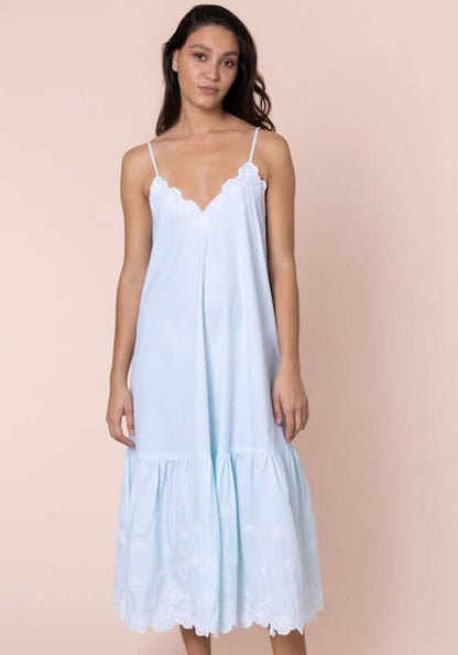 Poplin Floral Midi Dress Ice Blue by Juliet Dunn model wearing dress with V-neckline and floral details.