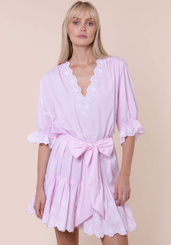 Poplin Floral Tie Waist Dress Petal Pink by Juliet Dunn, showcasing a model wearing a pink dress with lace details and a tie waist.