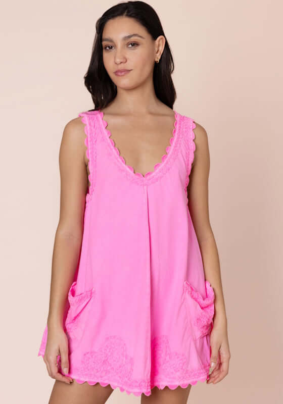 Ric Rac low Back Dress Hot Pink by Juliet Dunn, featuring a sleeveless design, patch pockets, and vibrant pink color.