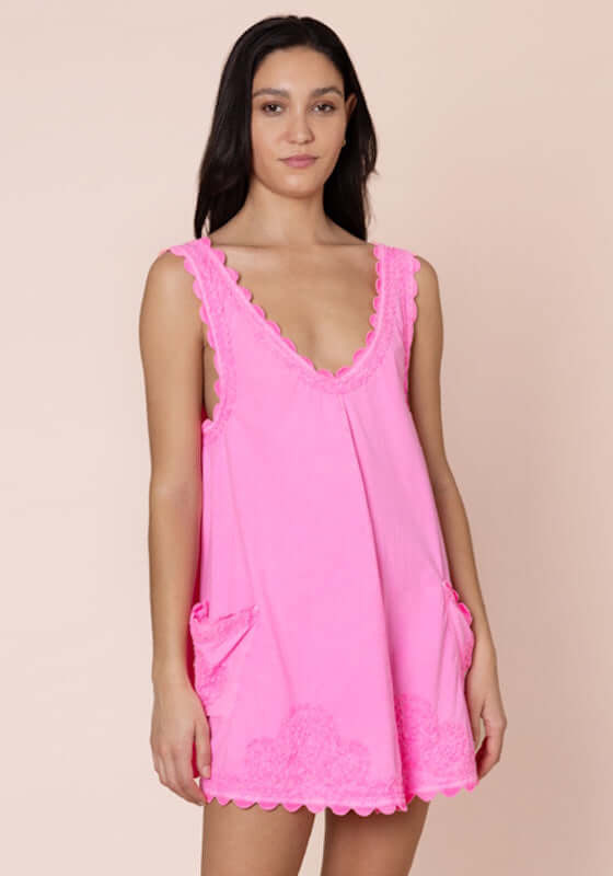 Ric Rac low Back Dress Hot Pink by Juliet Dunn, featuring a playful design with patch pockets and a chic low back.