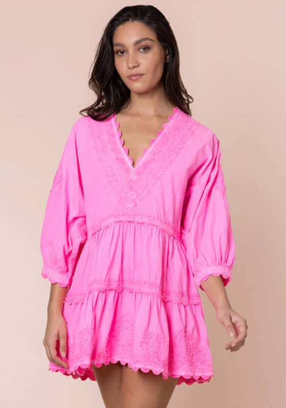 Ric Rac Tiered Mini Dress Hot Pink by Juliet Dunn, model wearing a vibrant tiered mini dress with ric rac detailing.