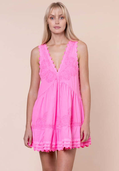 Ric Rac V Neck Dress Hot Pink by Juliet Dunn, model wearing a vibrant hot pink dress with V neckline and ric rac detailing.