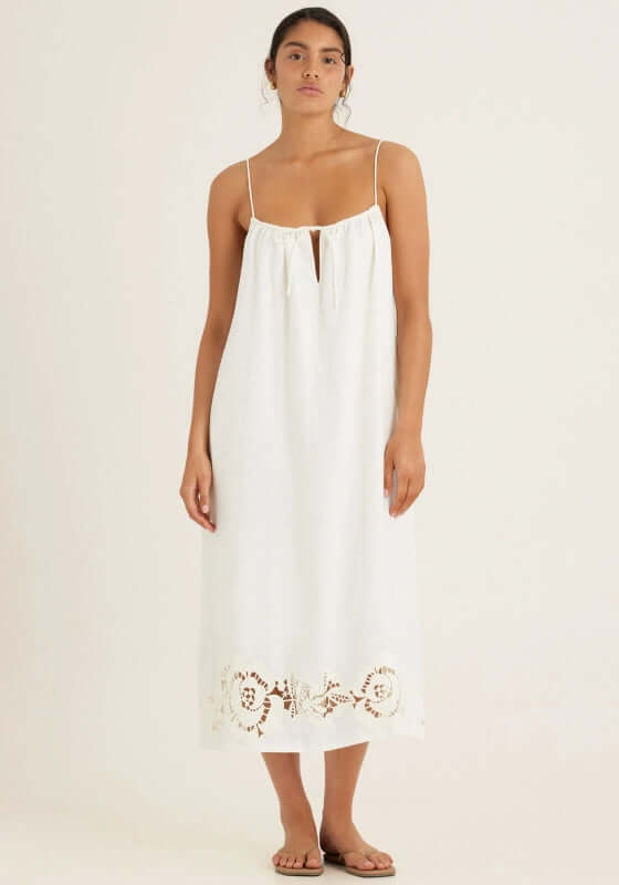 Embroidered Midi Dress Gardenia by Peony, featuring a loose-fit design, spaghetti straps, and intricate hem embroidery.