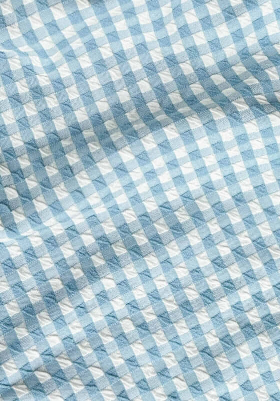 Bustier Bandeau Bikini Chambray Gingham by Peony, close-up of soft chambray gingham fabric in blue and white pattern.