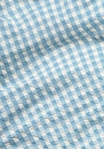 Bustier Bandeau Bikini Chambray Gingham by Peony, close-up of soft chambray gingham fabric in blue and white pattern.