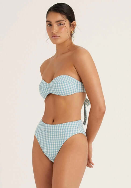 Bustier Bandeau Bikini Chambray Gingham by Peony model wearing a chic bandeau top and high-rise bottom in chambray gingham.