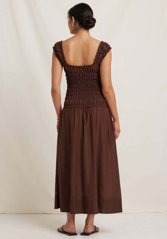 Sonnet Midi Dress Pecan by Peony, showcasing a back view with smocked bodice and elegant midi length in rich brown.