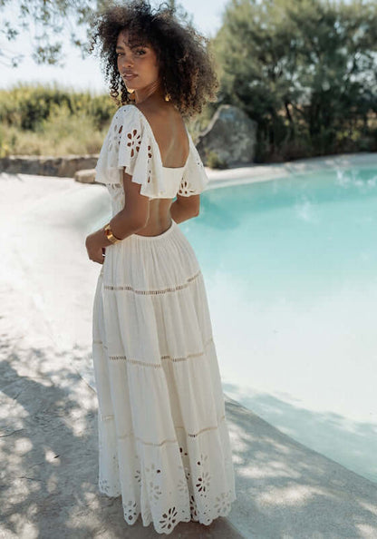Florencia Dress Natural by Piti Cuiti, elegant dress with open back and flowy sleeves, perfect for warm-weather occasions.
