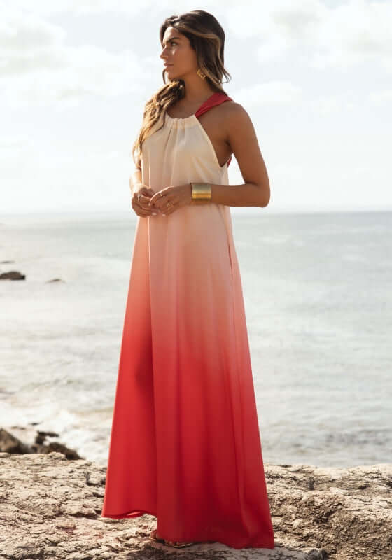 Santorini Dress Sunset Ombre Red by Sole Lisboa, a flowy maxi dress with ombre red tones by the beach.