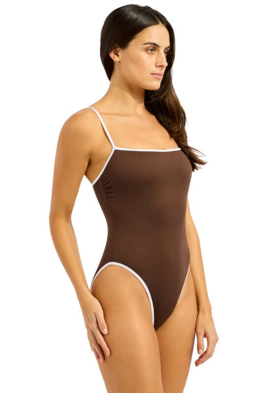 Beach Bound Square Neck Swimsuit Chocolate by Seafolly, showcases a model in a chocolate swimsuit with white trim.