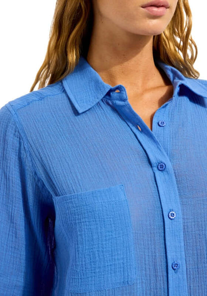 Sapphire Breeze Beach Shirt by Seafolly, a close-up of the vibrant blue fabric and button details.