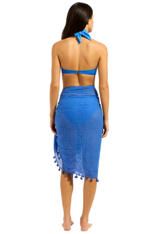 Cotton Gauze Sarong Sapphire by Seafolly, model showcasing the lightweight sapphire sarong with tassel trim.