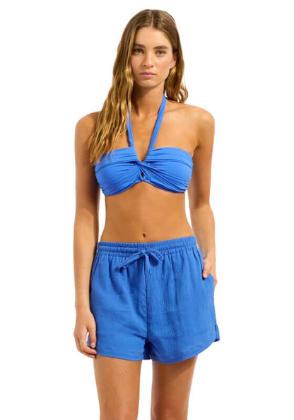 Sapphire Crinkle Beach Shorts by Seafolly worn with a stylish bikini, perfect for beach outings and summer fun.