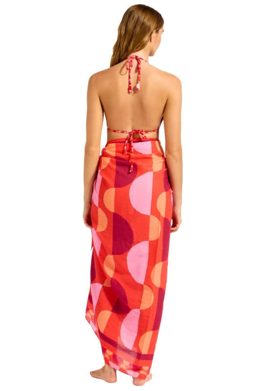 Sorrento Flame Sarong by Seafolly worn as a wrap, showcasing a vibrant geometric print in warm colors.