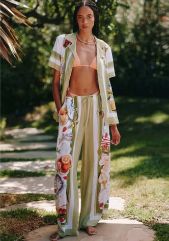 Riviera Coast Beach Trousers by Seafolly, model wearing beach trousers with floral patterns and light fabric outdoors.