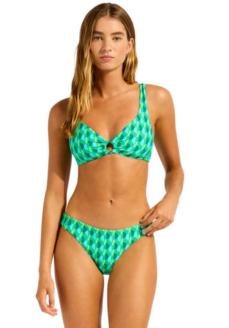 Ring Front Sorrento Vivid Green Tank Bikini by Seafolly, model wearing vibrant green bikini by the water.