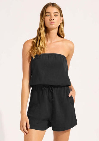 Crinkle Playsuit Black by Seafolly, showcasing a model in a strapless black playsuit with side pockets.